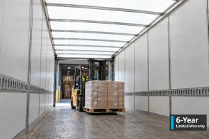Forklift loading a pallet into a semi-trailer with a CargoBright translucent roof, with a 6-Year Limited Warranty badge